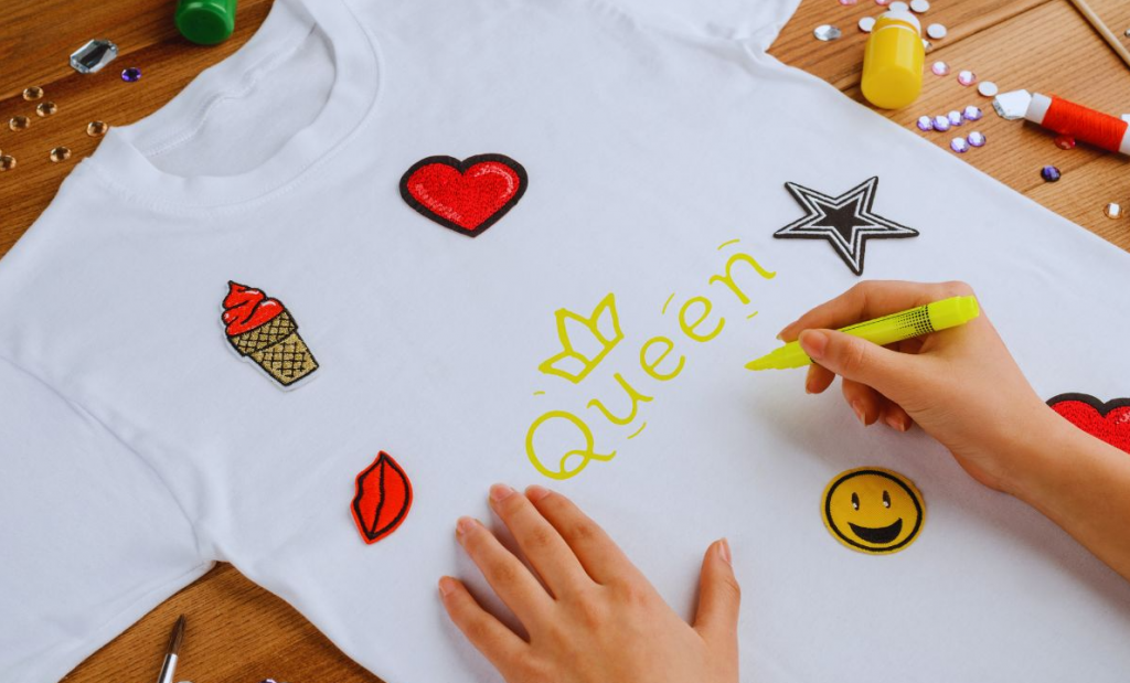 Girl's hand customizing tshirt representing print on demand business for women