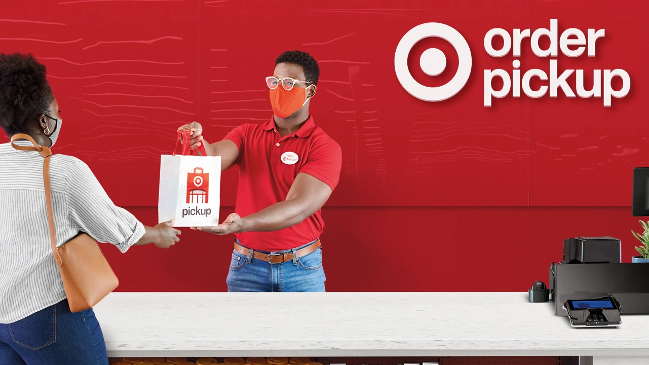 Target store associate handing over a Shopify pickup in-store order for seamless omnichannel shopping experience