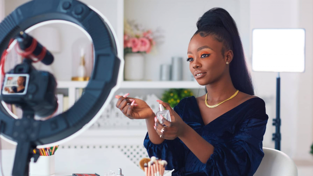 Lady shooting video with lights representing content creating as business for women