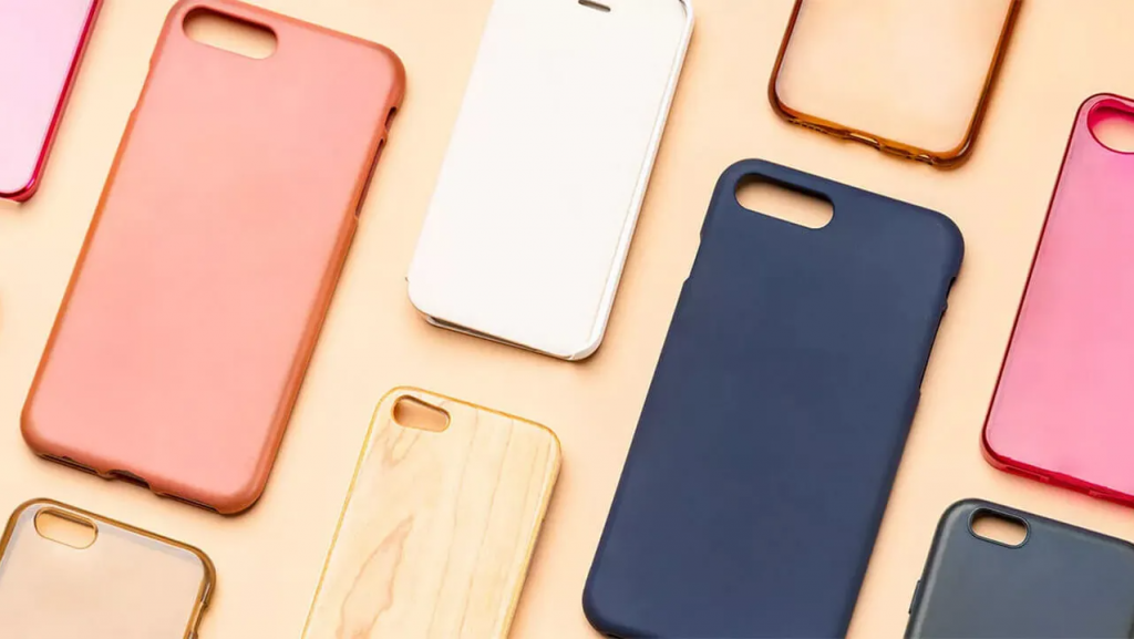 An assortment of wholesale phone cases, including silicone and hard-shell options, for a variety of smartphone models