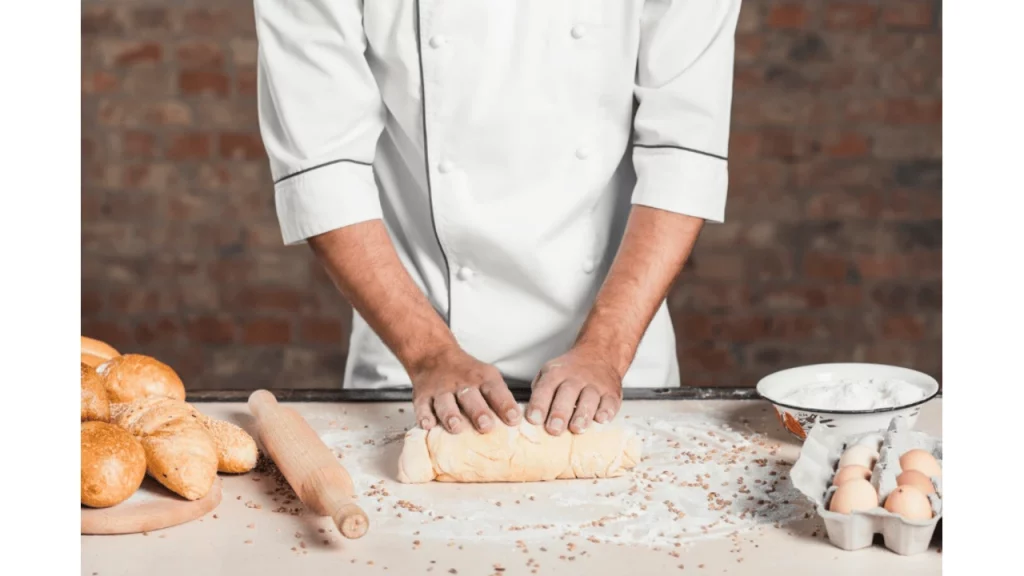 A baker preparing a baked food item